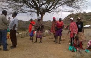 Ngorika in Isiolo, the ladies have carried samples in the green plastic bags and milk in the gourd/can.